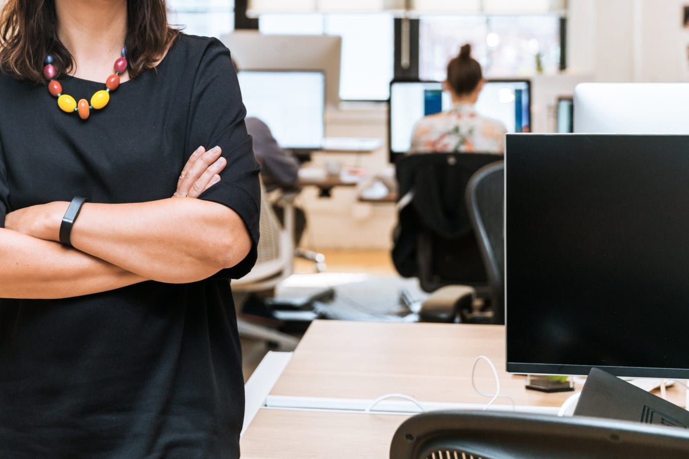 smiling-businesswoman-in-office_4460x4460